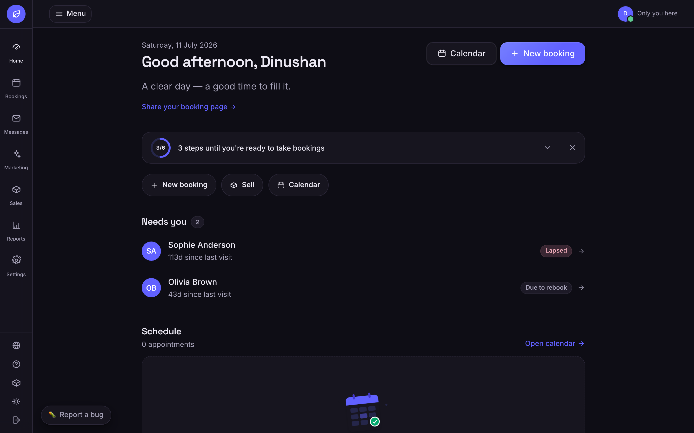The same booking dashboard photographed in dark theme